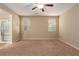 Comfortable bedroom featuring neutral walls, plush carpeting, and a ceiling fan at 1172 Via Della Costrella, Henderson, NV 89011