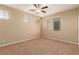 This bedroom has carpet, neutral paint and two windows with blinds at 1172 Via Della Costrella, Henderson, NV 89011