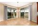 Dining area with large sliding glass doors provides ample natural light and views of the backyard at 1172 Via Della Costrella, Henderson, NV 89011