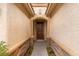 Front entry with stonework and a dark brown door at 1172 Via Della Costrella, Henderson, NV 89011