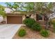 Charming home with a two-car garage, complemented by desert landscaping and a welcoming front entrance at 1172 Via Della Costrella, Henderson, NV 89011