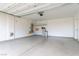 Spacious garage with epoxy flooring, water softener, and ample room for vehicles and storage at 1172 Via Della Costrella, Henderson, NV 89011