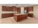 Large kitchen island with granite countertops at 1172 Via Della Costrella, Henderson, NV 89011