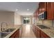 Modern kitchen with granite countertops and island at 1172 Via Della Costrella, Henderson, NV 89011