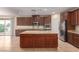 Spacious kitchen with island, stainless steel appliances, and granite countertops at 1172 Via Della Costrella, Henderson, NV 89011