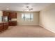 Inviting living space with natural light, featuring a view to the kitchen with stainless steel appliances at 1172 Via Della Costrella, Henderson, NV 89011