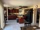 Kitchen with dark wood cabinets, granite countertops, and a kitchen island at 1754 Green Apple Way, Las Vegas, NV 89142