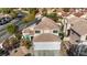 Two-story house with solar panels and a three-car garage, aerial view at 1812 Dalton Dr, Henderson, NV 89014