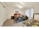 Bedroom with queen bed and twin bed, featuring a cheerful sunflower quilt at 1812 Dalton Dr, Henderson, NV 89014