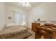 Cozy bedroom with natural light, tile flooring and charming vintage furniture at 1812 Dalton Dr, Henderson, NV 89014