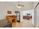 Bright bedroom featuring neutral walls, tile floors, and a doorway leading into the living room at 1812 Dalton Dr, Henderson, NV 89014