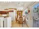 Cozy kitchen dining area with a table for four and view of the backyard at 1812 Dalton Dr, Henderson, NV 89014