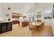 Kitchen and dining area with wood table and chairs, and a view to the living room at 1812 Dalton Dr, Henderson, NV 89014