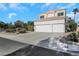 Two-story house with three-car garage and desert landscaping at 1812 Dalton Dr, Henderson, NV 89014