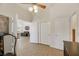 View of an interior space with an exercise machine, doors, and a glimpse of a living area at 1812 Dalton Dr, Henderson, NV 89014