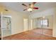 Bright bedroom with mirrored closet doors and ceiling fan at 1830 N Buffalo Dr # 1007, Las Vegas, NV 89128