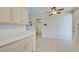 Bright kitchen with light cabinets and tile floor at 1830 N Buffalo Dr # 1007, Las Vegas, NV 89128