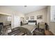 Inviting bedroom offers a queen-size bed with a modern desk setup and closet at 2107 Inverness Dr, Henderson, NV 89074