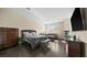 Main bedroom with fireplace, sitting area, and dark wood floors at 2107 Inverness Dr, Henderson, NV 89074