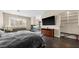 Expansive main bedroom with fireplace, sitting area, and seamless flow to the ensuite bathroom at 2107 Inverness Dr, Henderson, NV 89074