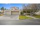 Two-story house with attached two-car garage and landscaped front yard at 2107 Inverness Dr, Henderson, NV 89074