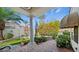 Brick paved patio with a marble column and lush landscaping at 2107 Inverness Dr, Henderson, NV 89074