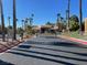 Gated community entrance with palm trees and security features at 2120 Ramrod Ave # 1721, Henderson, NV 89014