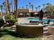 Community pool with BBQ grills and seating at 2120 Ramrod Ave # 1721, Henderson, NV 89014