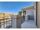 Exterior balcony overlooking the community, with wrought iron railing and textured walls at 217 Via Luna Rosa Ct, Henderson, NV 89011