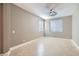 This is a bedroom featuring neutral walls, large windows, and neutral tile floors at 217 Via Luna Rosa Ct, Henderson, NV 89011