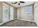 This is a bedroom featuring neutral walls, large windows, ceiling fan, and neutral carpet at 217 Via Luna Rosa Ct, Henderson, NV 89011