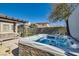 Relaxing hot tub in a backyard setting, with mature trees and a patio at 217 Via Luna Rosa Ct, Henderson, NV 89011