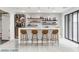 Modern home bar with wine storage and seating for four at 2272 Horizon Light Ct, Henderson, NV 89052