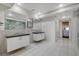 Modern bathroom with double vanity and marble shower at 2272 Horizon Light Ct, Henderson, NV 89052