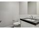 Modern bathroom with white subway tile and dark vanity at 2272 Horizon Light Ct, Henderson, NV 89052