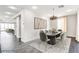 Elegant dining room with a modern table and chairs at 2272 Horizon Light Ct, Henderson, NV 89052