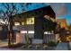 Contemporary home with a dramatic, dark facade and landscaping at 2272 Horizon Light Ct, Henderson, NV 89052