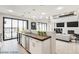 Modern kitchen with a breakfast bar and views to backyard at 2272 Horizon Light Ct, Henderson, NV 89052