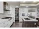 Modern kitchen with white cabinets, stainless steel appliances, and an island at 2272 Horizon Light Ct, Henderson, NV 89052