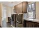 Laundry room with modern washer, dryer, and cabinets at 2272 Horizon Light Ct, Henderson, NV 89052