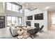 Open living room with high ceilings and modern fireplace at 2272 Horizon Light Ct, Henderson, NV 89052