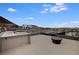 Outdoor kitchen & firepit on rooftop patio with city views at 2272 Horizon Light Ct, Henderson, NV 89052