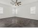 Bright bedroom featuring dark grey floor tile and multiple windows at 2364 Boretto St, Henderson, NV 89044