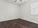 Bright bedroom with dark brown wood-look floors and window coverings at 2364 Boretto St, Henderson, NV 89044