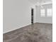 Bright dining room with modern chandelier and dark gray tile floor at 2364 Boretto St, Henderson, NV 89044