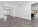 Spacious dining area with dark gray tile floors and modern chandelier at 2364 Boretto St, Henderson, NV 89044