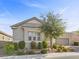 Single-story house with light-colored siding, a two-car garage, and well-manicured landscaping at 2364 Boretto St, Henderson, NV 89044