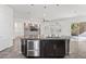 Large kitchen island with double sinks and stainless steel appliances at 2364 Boretto St, Henderson, NV 89044