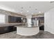 Modern kitchen with large island and stone backsplash at 2364 Boretto St, Henderson, NV 89044