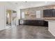 Kitchen features dark cabinetry and access to backyard at 2364 Boretto St, Henderson, NV 89044